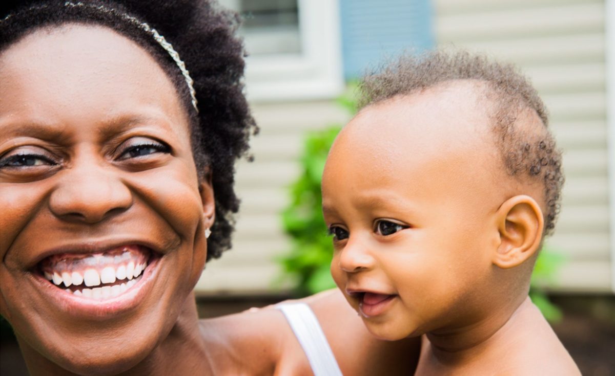 Woman with cute baby smiling